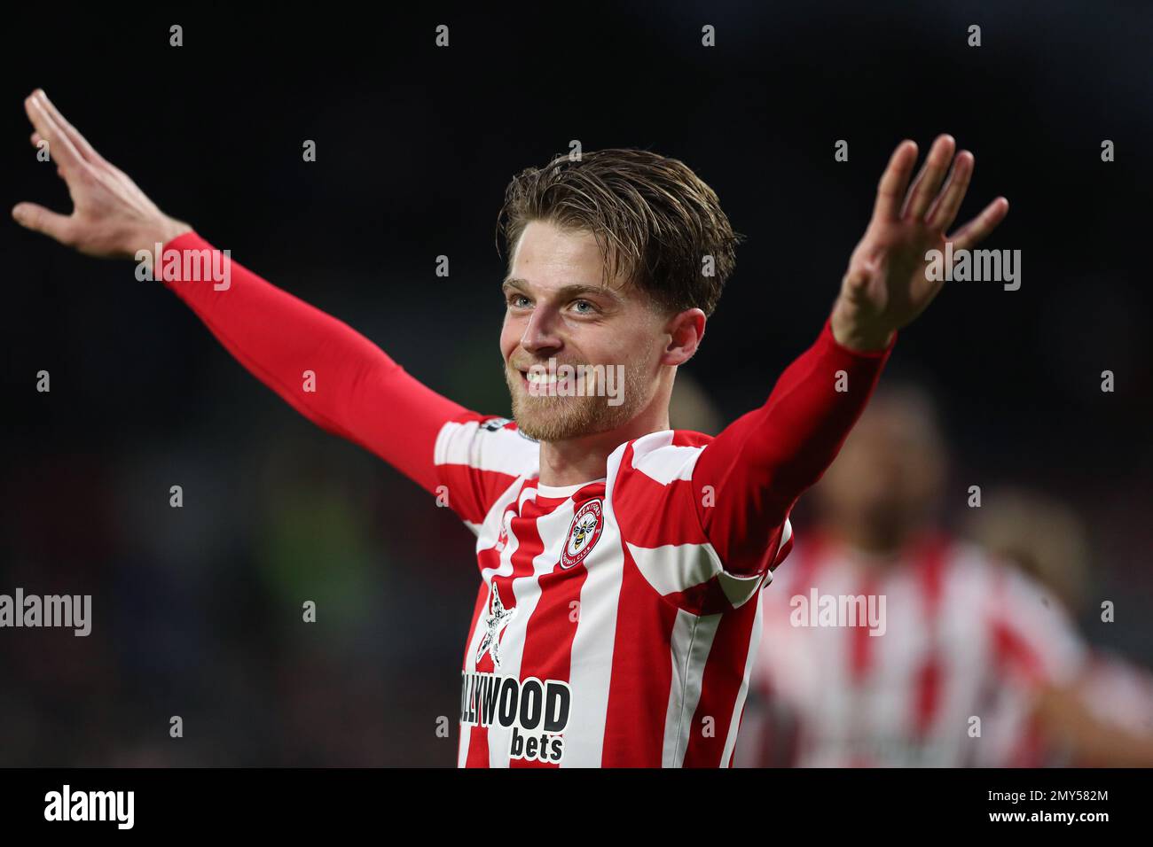 London, UK. 04th Feb, 2023. 4th February 2023; Gtech Community Stadium, Brentford, London, England; Premier League Football, Brentford versus Southampton; Mathias Jensen of Brentford celebrates towards the Brentford fans after scoring his sides 3rd goal in the 79th minute to make it 3-0 Stock Photo