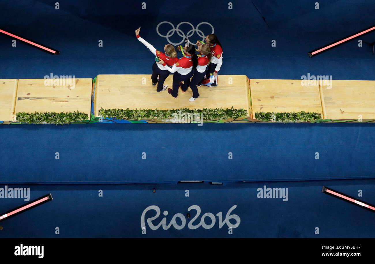 Fencers of the Russian team take a selfie photo on the podium after winning the gold medal in a