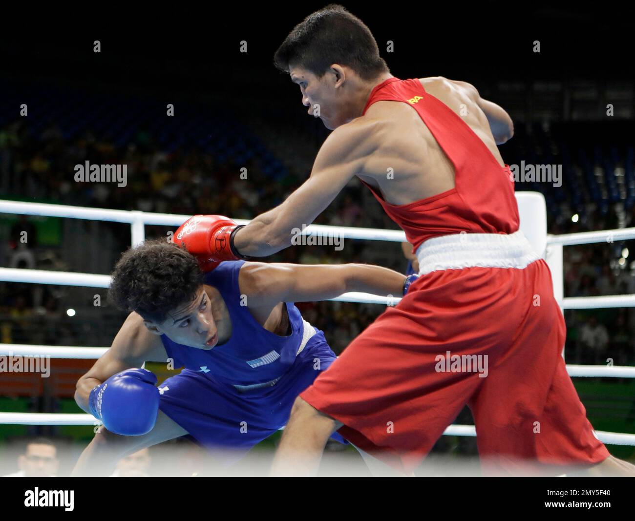 United States' Antonio Vargas, left, fights Brazil's Juliao Neto during a men's flyweight 52-kg preliminary boxing match at the 2016 Summer Olympics in Rio de Janeiro, Brazil, Saturday, Aug. 13, 2016. (AP Photo/Frank Franklin II) Stock Photo