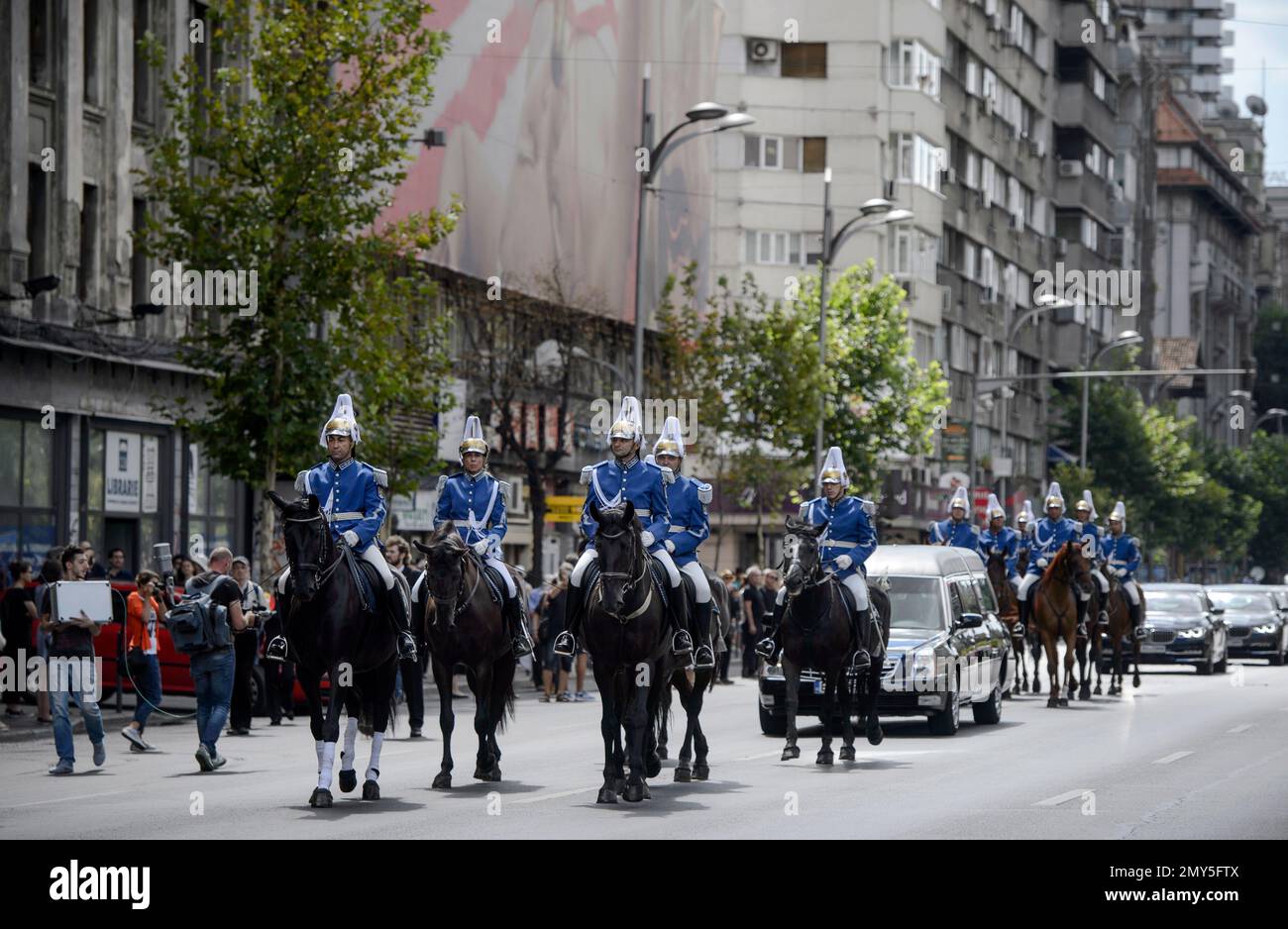 Romanian gendarmes on horseback lead the hearse with the coffin of Anne of Romania, wife of
