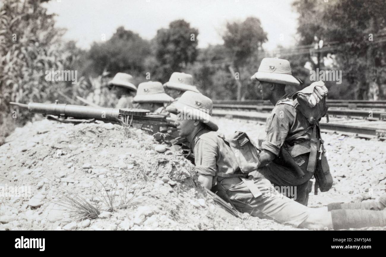 Soldiers of the 2nd Battalion King's Own Yorkshire Light Infantry armed with a Lewis gun protecting a railway line on the Nort West Frontier region of British India c. early 1930s.. Stock Photo