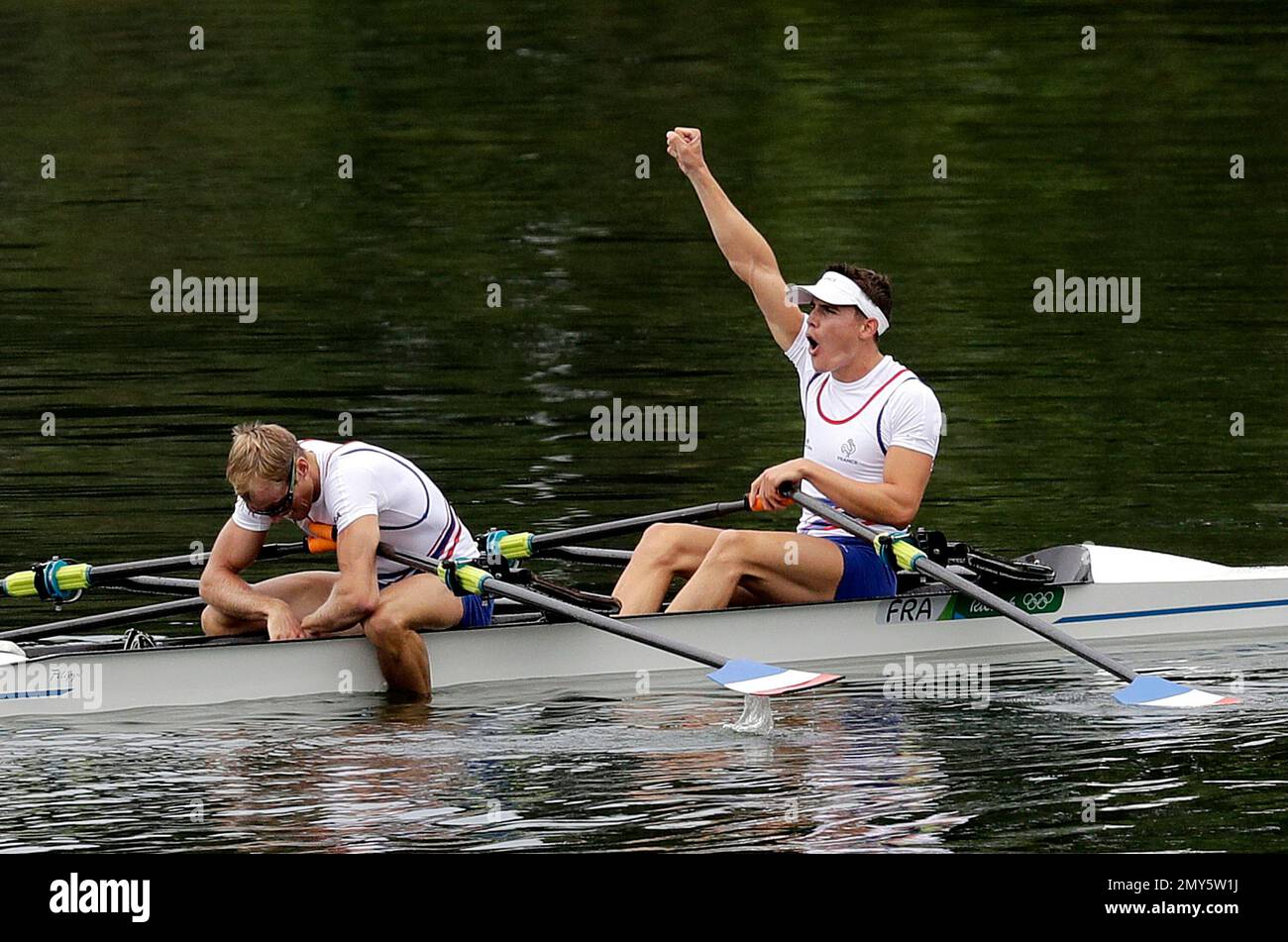 Pierre Houin and Jeremie Azou ,of France, celebrate winning gold in the