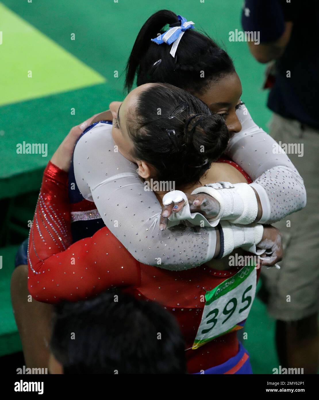 United States' Simone Biles embraces teammate Aly Raisman after the ...