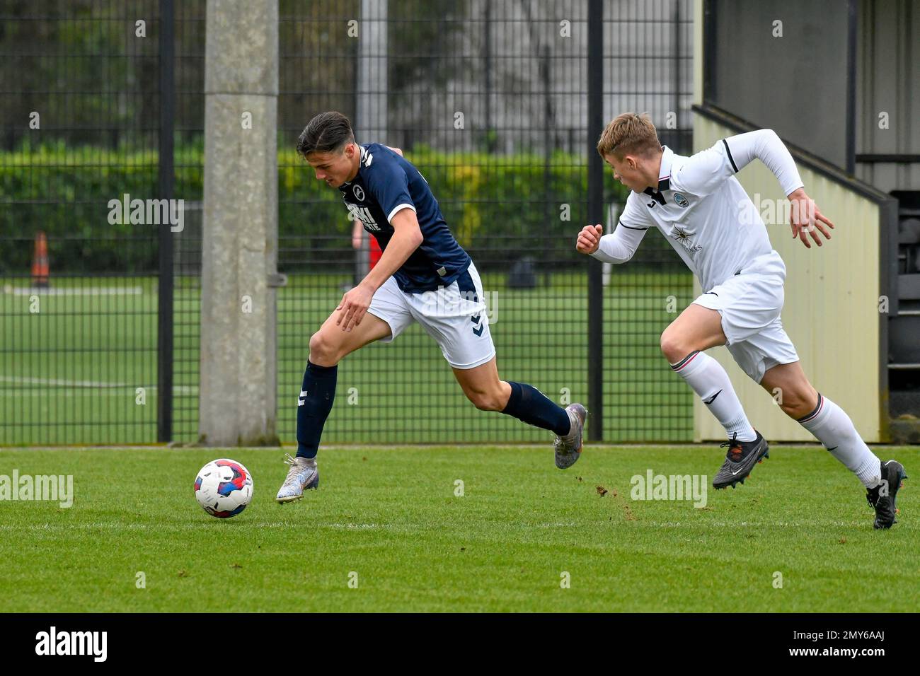 Swansea, Wales. 4 February 2023. Aimar Govea of Swansea City under pressure  from Finley Cotton of Millwall during the Professional Development League  game between Swansea City Under 18 and Millwall Under 18