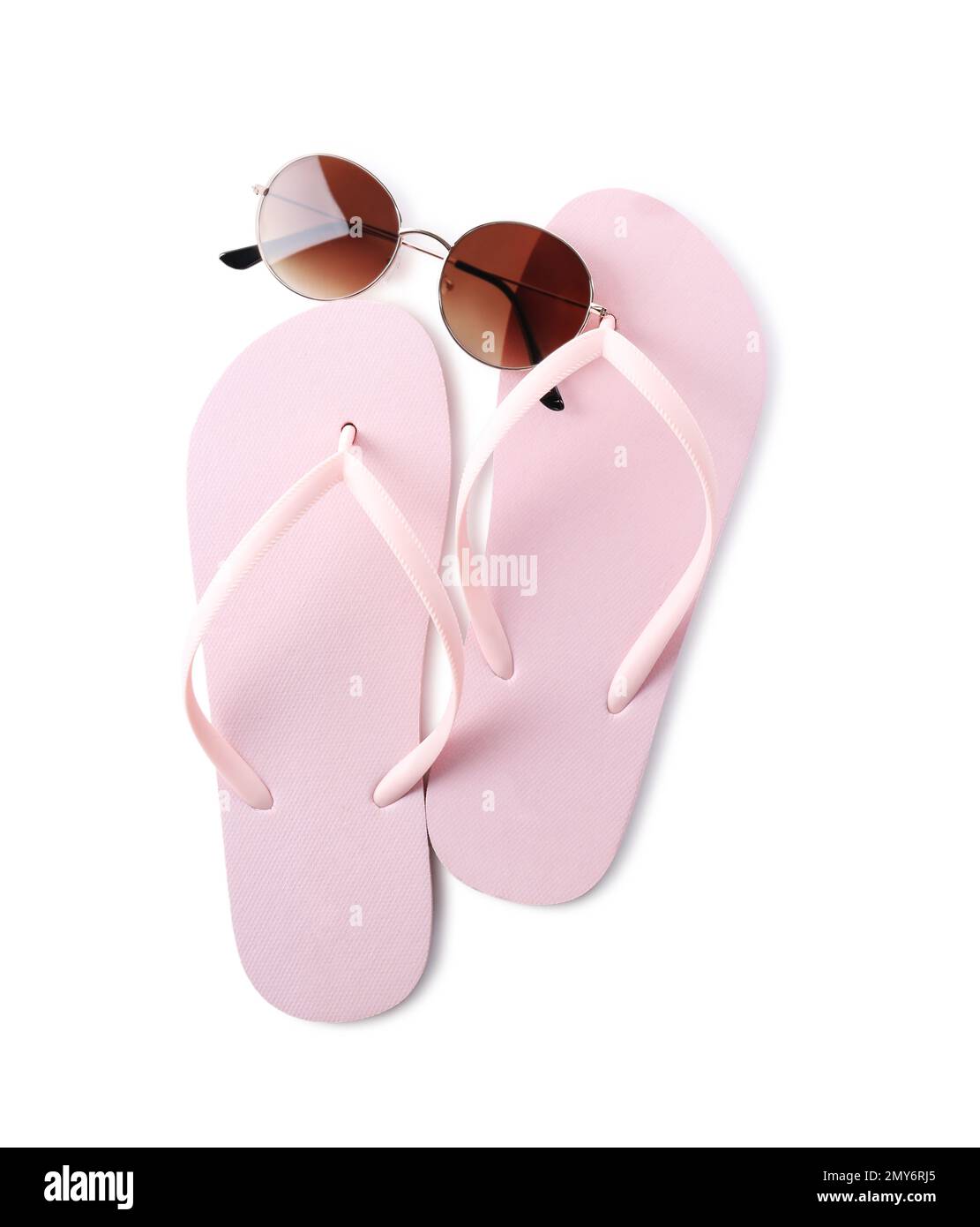 Flip flops and sunglasses on white background, top view. Beach objects ...