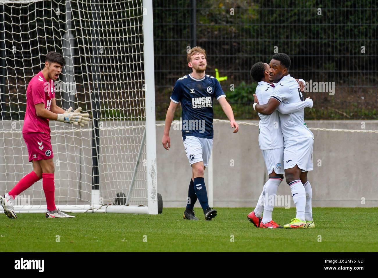 Swansea, Wales. 4 February 2023. Iwan Morgan of Swansea City high fives  Aimar Govea of Swansea City during the Professional Development League game  between Swansea City Under 18 and Millwall Under 18