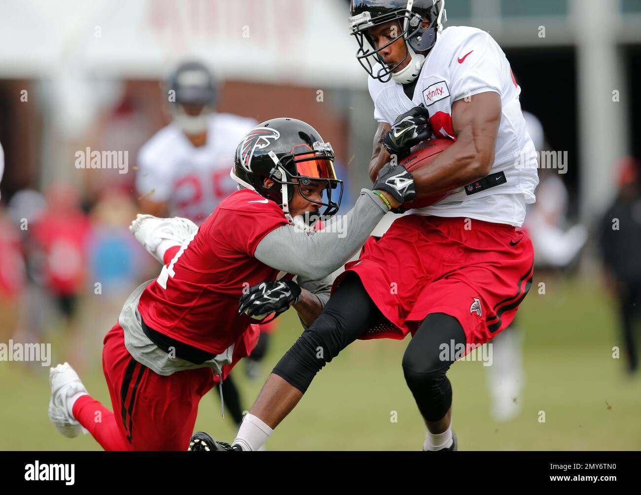 Atlanta Falcons wide receiver C.J. Goodwin (29) strips the ball