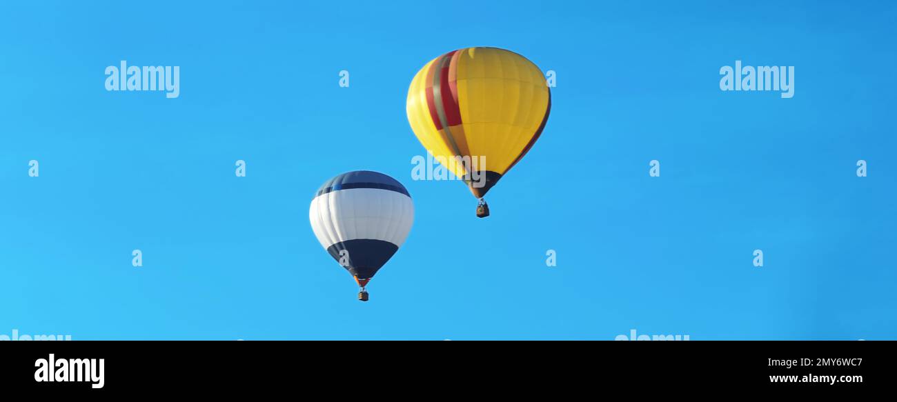 Hot air balloons in blue sky. Banner design Stock Photo Alamy