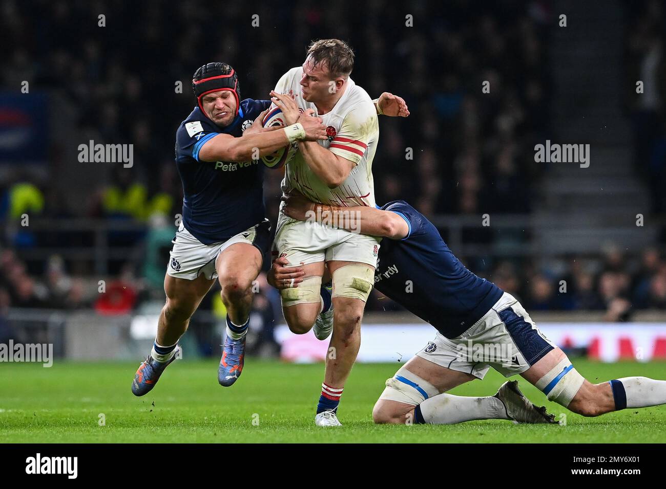 Alex Dombrandt of England is tackled by George Turner and Richie Gray of Scotland during the 2023 Guinness 6 Nations match England vs Scotland at Twickenham Stadium, Twickenham, United Kingdom, 4th February 2023 (Photo by Craig Thomas/News Images) in, on 2/4/2023. (Photo by Craig Thomas/News Images/Sipa USA) Credit: Sipa USA/Alamy Live News Stock Photo