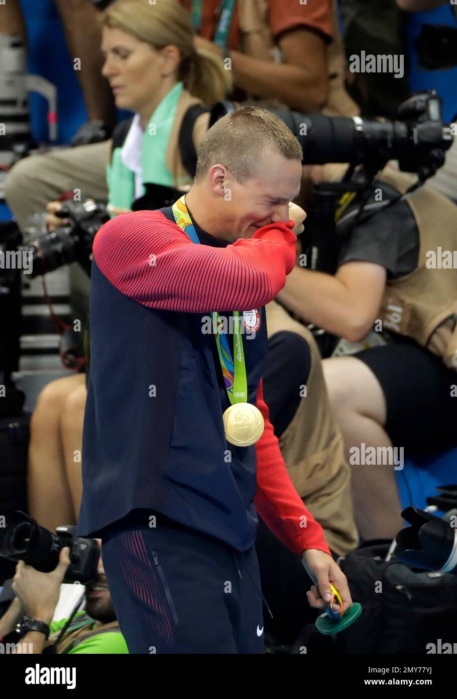 Caeleb Dressel from the United States cries after winning the gold ...