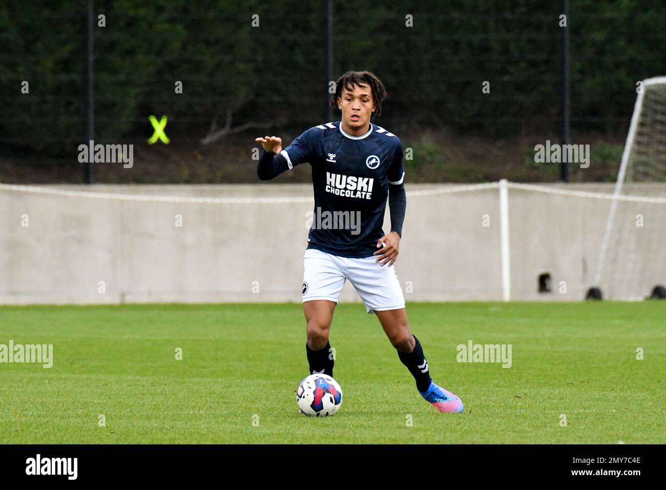 Swansea, Wales. 4 February 2023. Aimar Govea of Swansea City under pressure  from Finley Cotton of Millwall during the Professional Development League  game between Swansea City Under 18 and Millwall Under 18