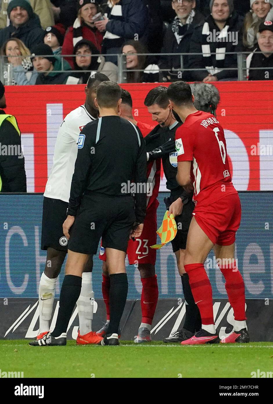 February 4th, 2023, Deutsche Bank Park, Frankfurt, GER, 1st FBL, Eintracht Frankfurt vs Hertha BSC Berlin, DFL regulations prohibit any use of photographs as image sequences and/or quasi-video. pictured linesman Stefan Lupp is dazed after being hit in the head by a ball. Stock Photo
