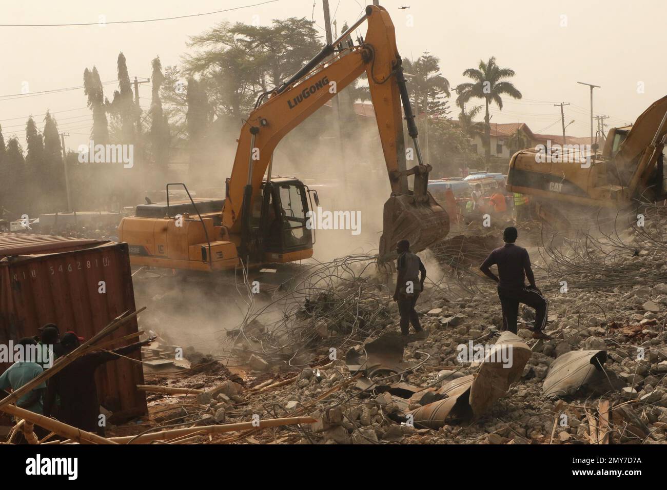 Rescue teams at the site of a 2-story building under construction that ...