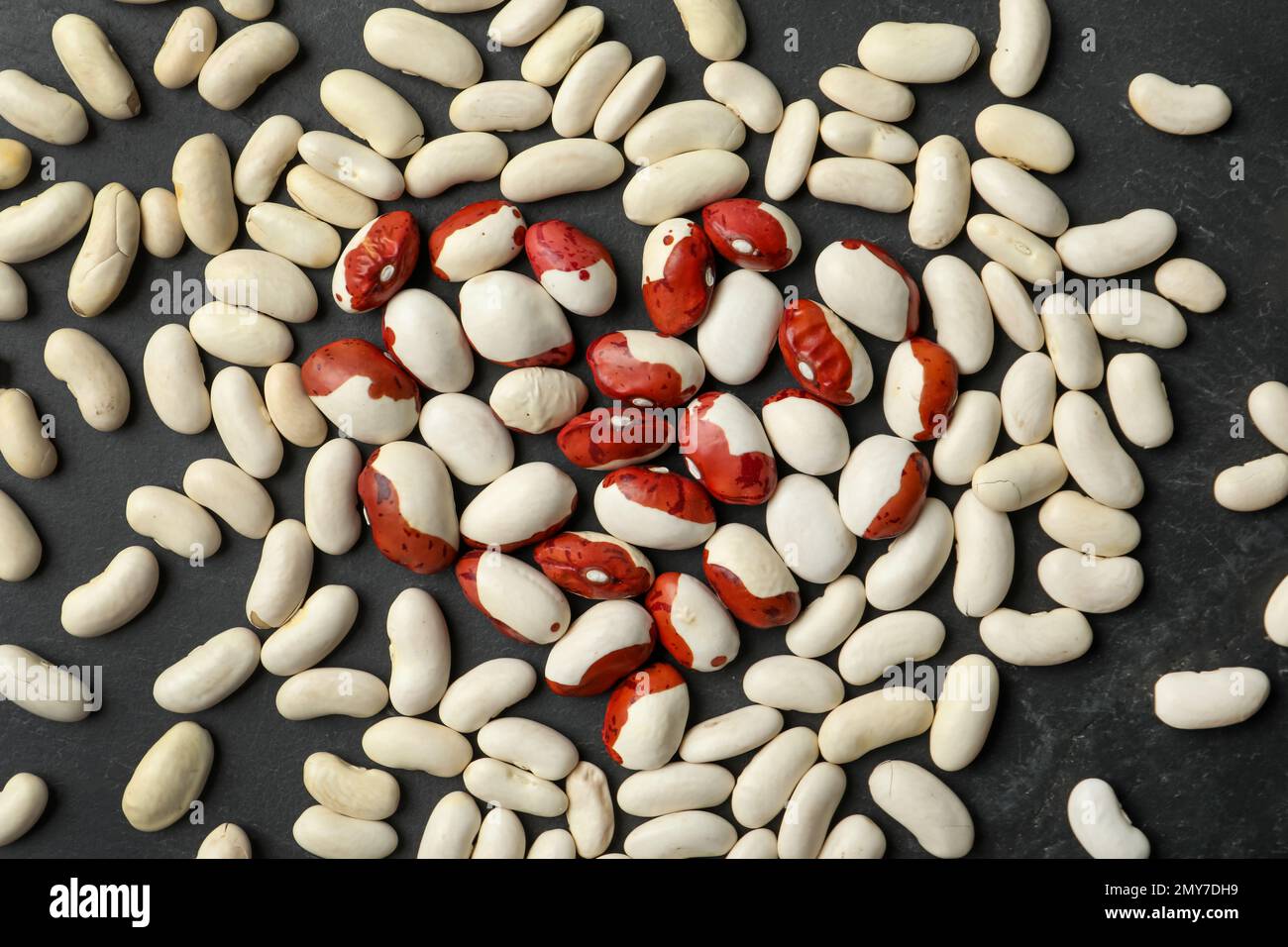 Raw beans on black background, flat lay. Vegetable seeds Stock Photo ...