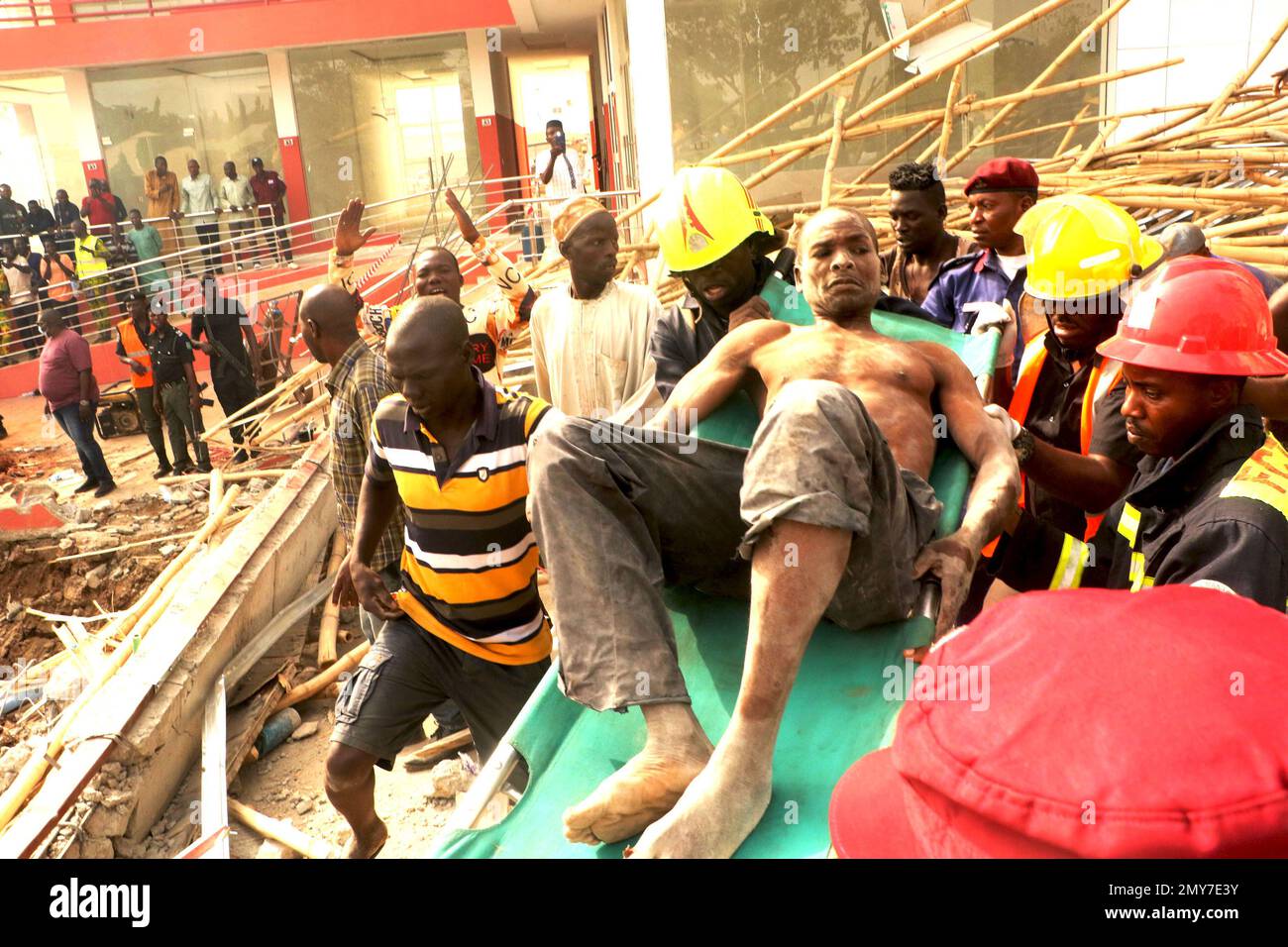 Rescue teams at the site of a 2-story building under construction that collapsed in Abuja, Nigeria’s capital city, Feb. 2, 2023. One person was confirmed dead, four persons rescued alive with serious injury and many were trapped under the rubbles after the two-story building collapsed. Nigeria. Stock Photo