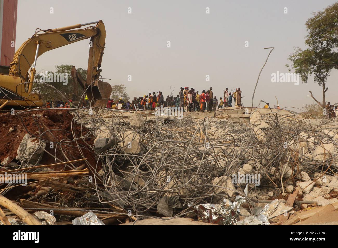 Rescue teams at the site of a 2-story building under construction that collapsed in Abuja, Nigeria’s capital city, Feb. 2, 2023. One person was confirmed dead, four persons rescued alive with serious injury and many were trapped under the rubbles after the two-story building collapsed. Nigeria. Stock Photo