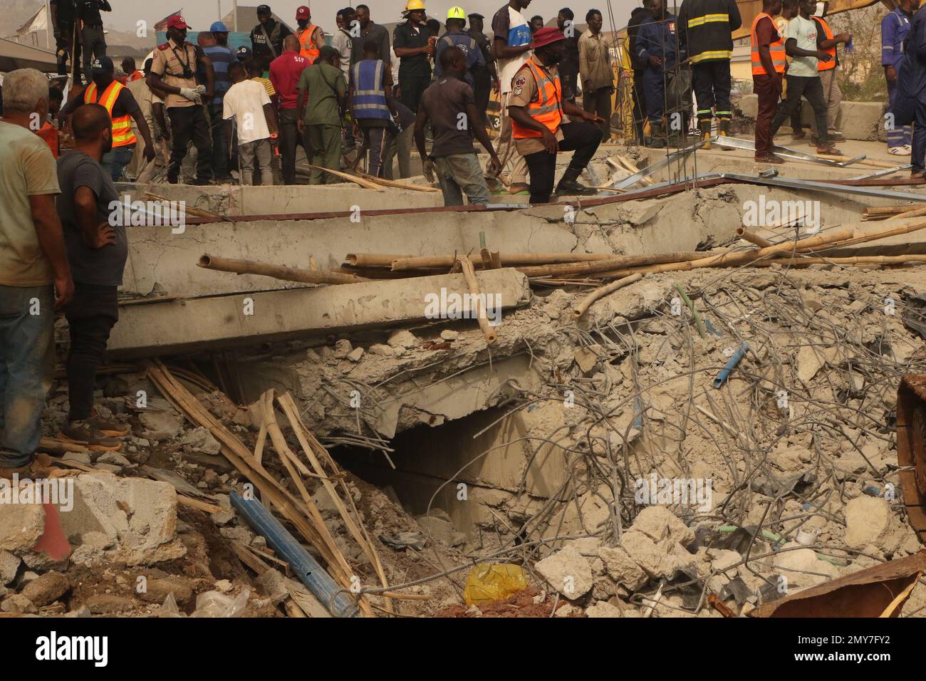Rescue teams at the site of a 2-story building under construction that ...