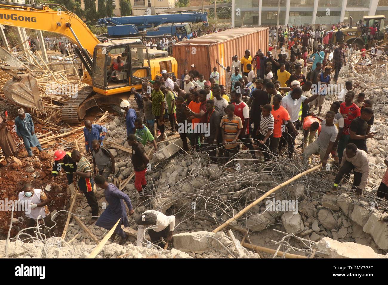 Rescue teams at the site of a 2-story building under construction that ...