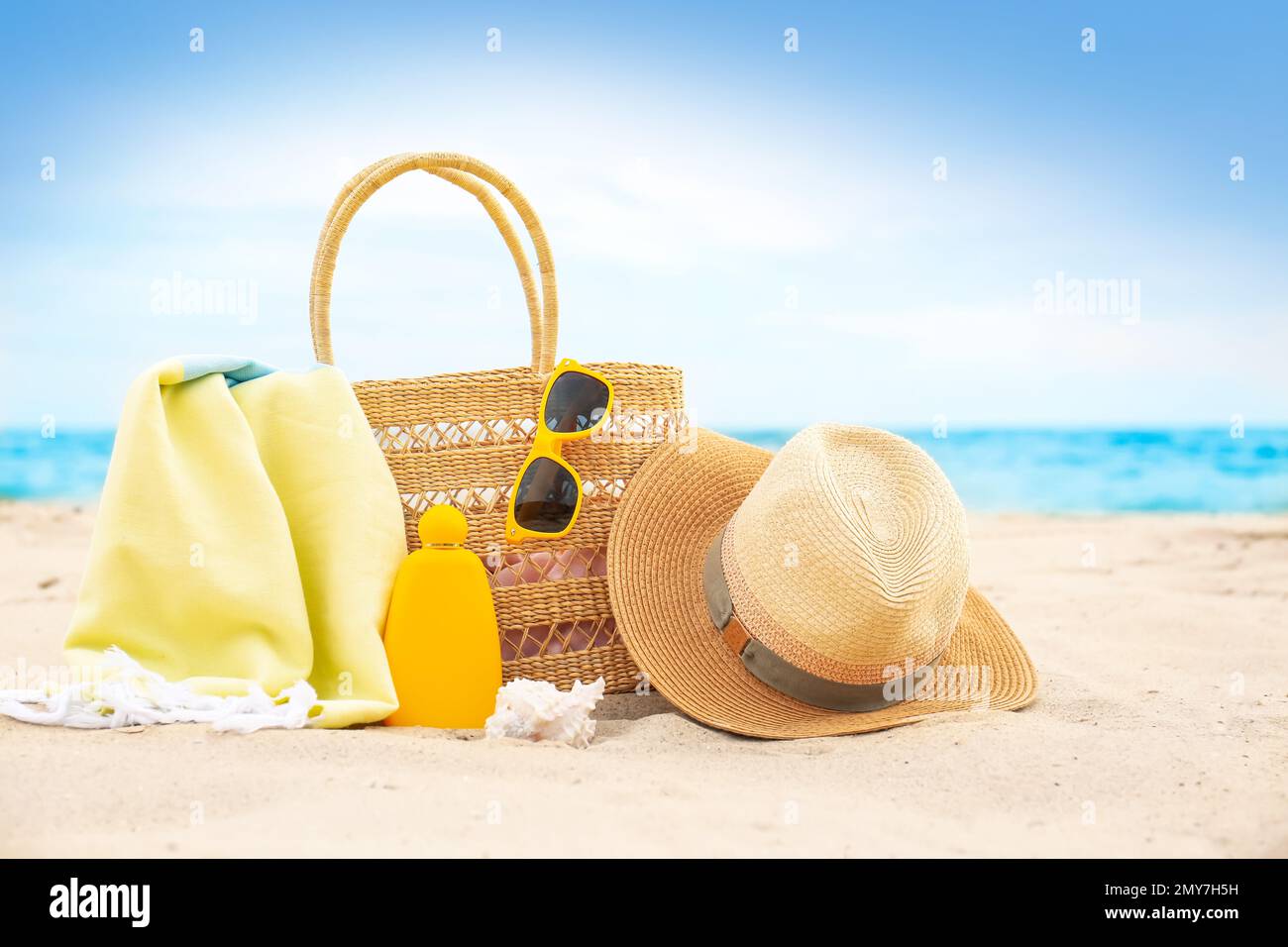 Different stylish beach objects and seashell on sand near sea Stock ...