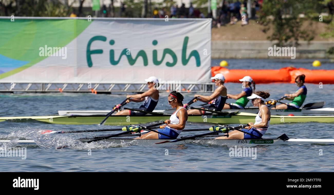 Helene Lefebvre and Elodie Ravera-Scaramozzino, of France, front, and  Victoria Thornley and Katie Greves, of Britain, center, compete in the  women's double sculll heat during the 2016 Summer Olympics in Rio de