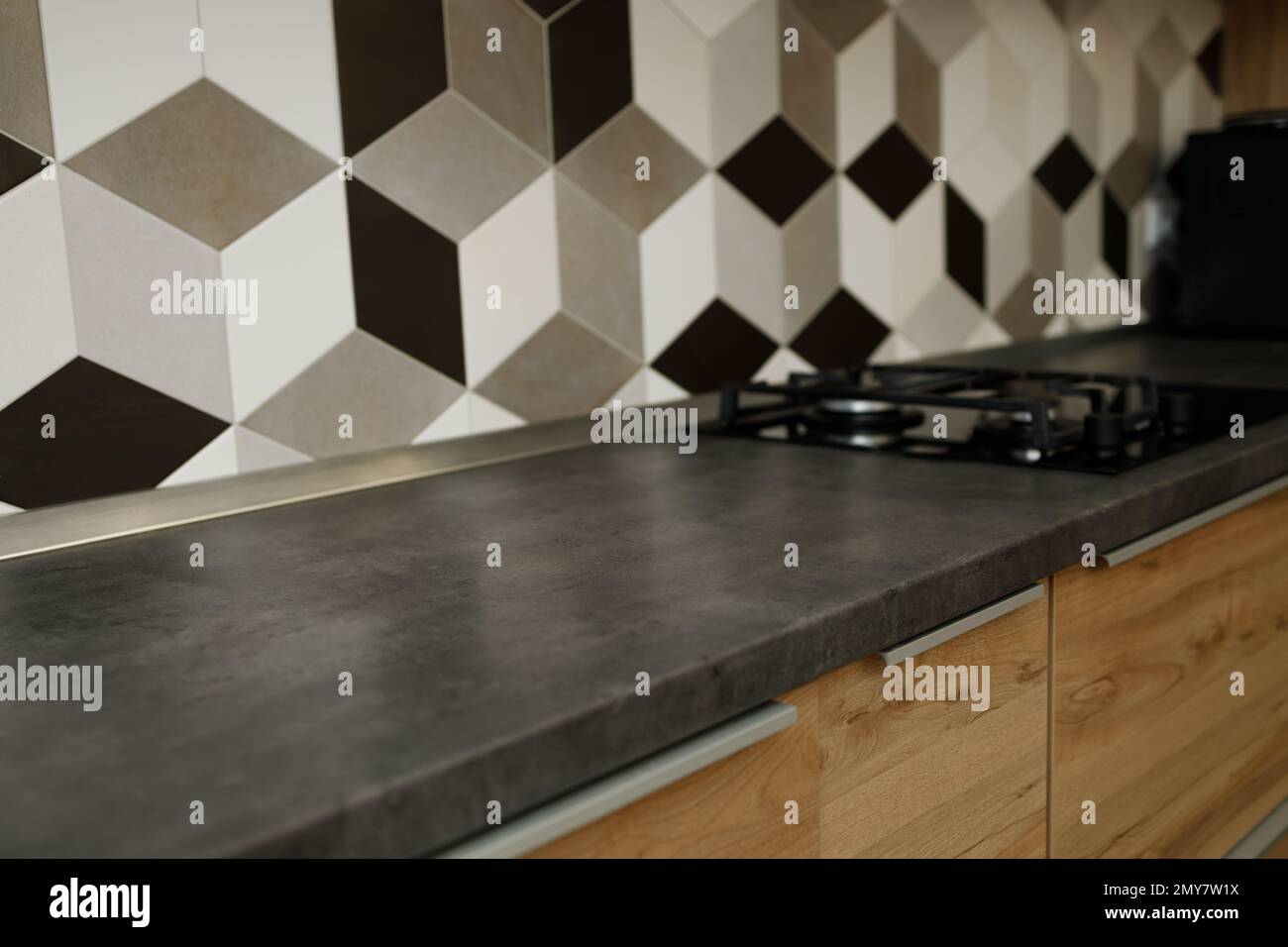 dark gray table top, kitchen surface and defocused, blurred modern