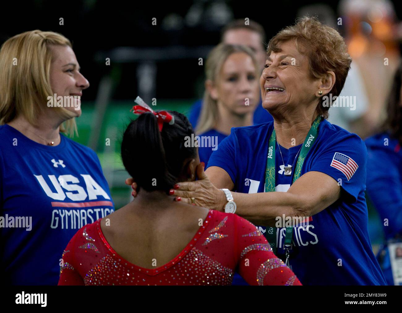Head coach Martha Karolyi reacts as United States' Simone Biles walks