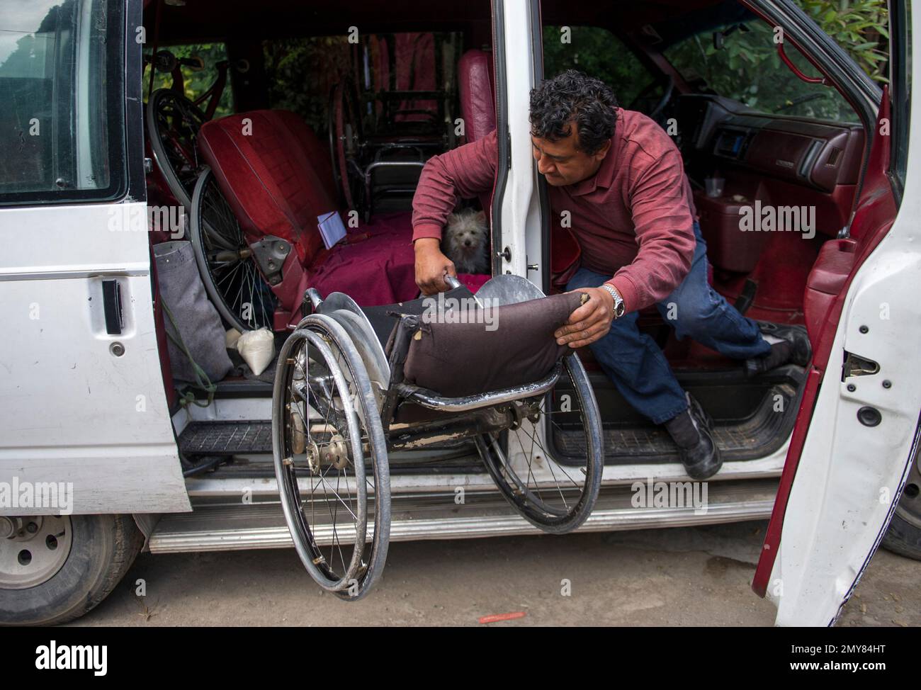 In this July 21, 2016 photo, Salvador Espinoza lifts his wheelchair