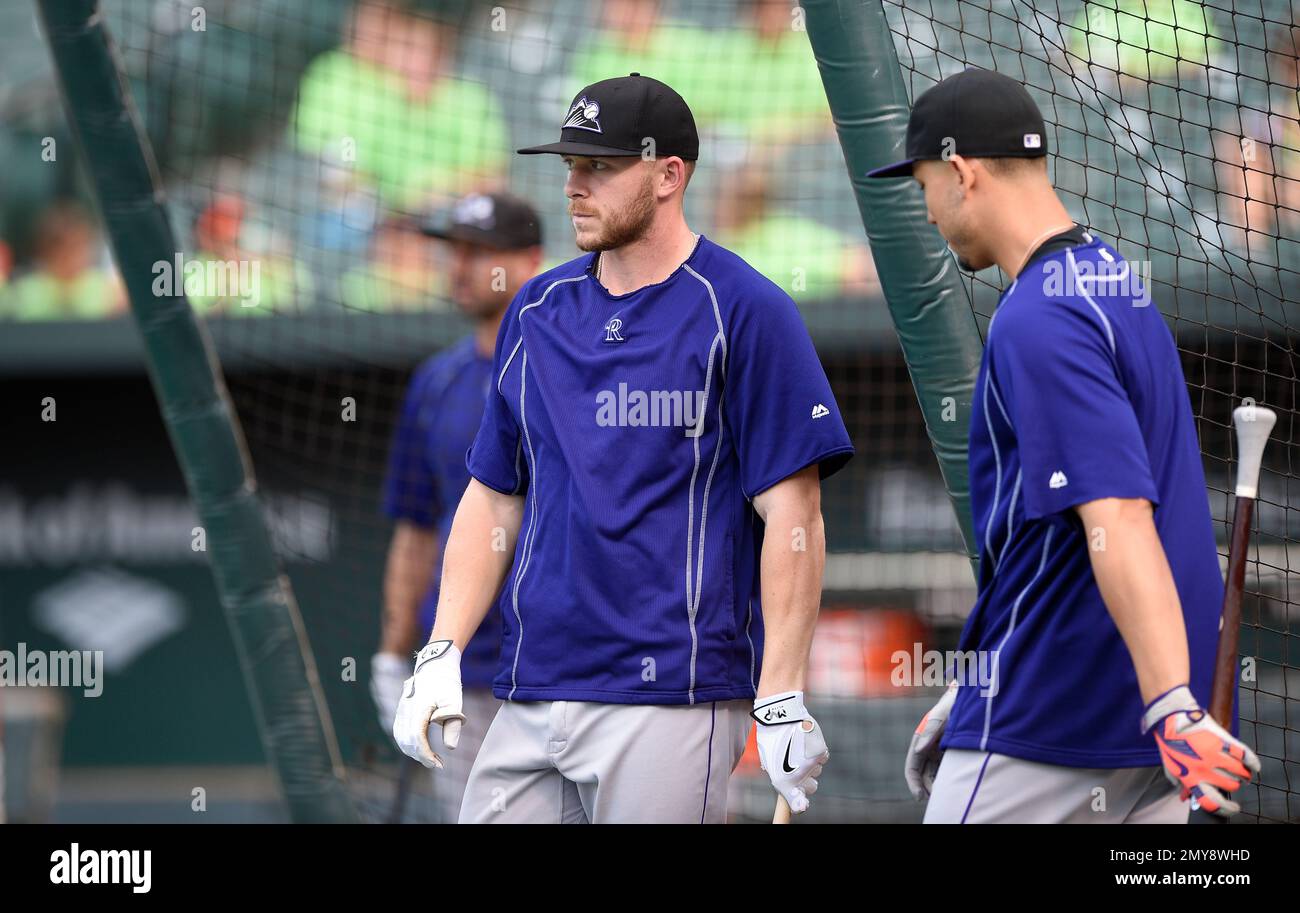 Colorado Rockies' Trevor Story looks skyward as he arrives home after  hitting a solo home run during the eighth inning of the team's baseball  game against the St. Louis Cardinals on Tuesday