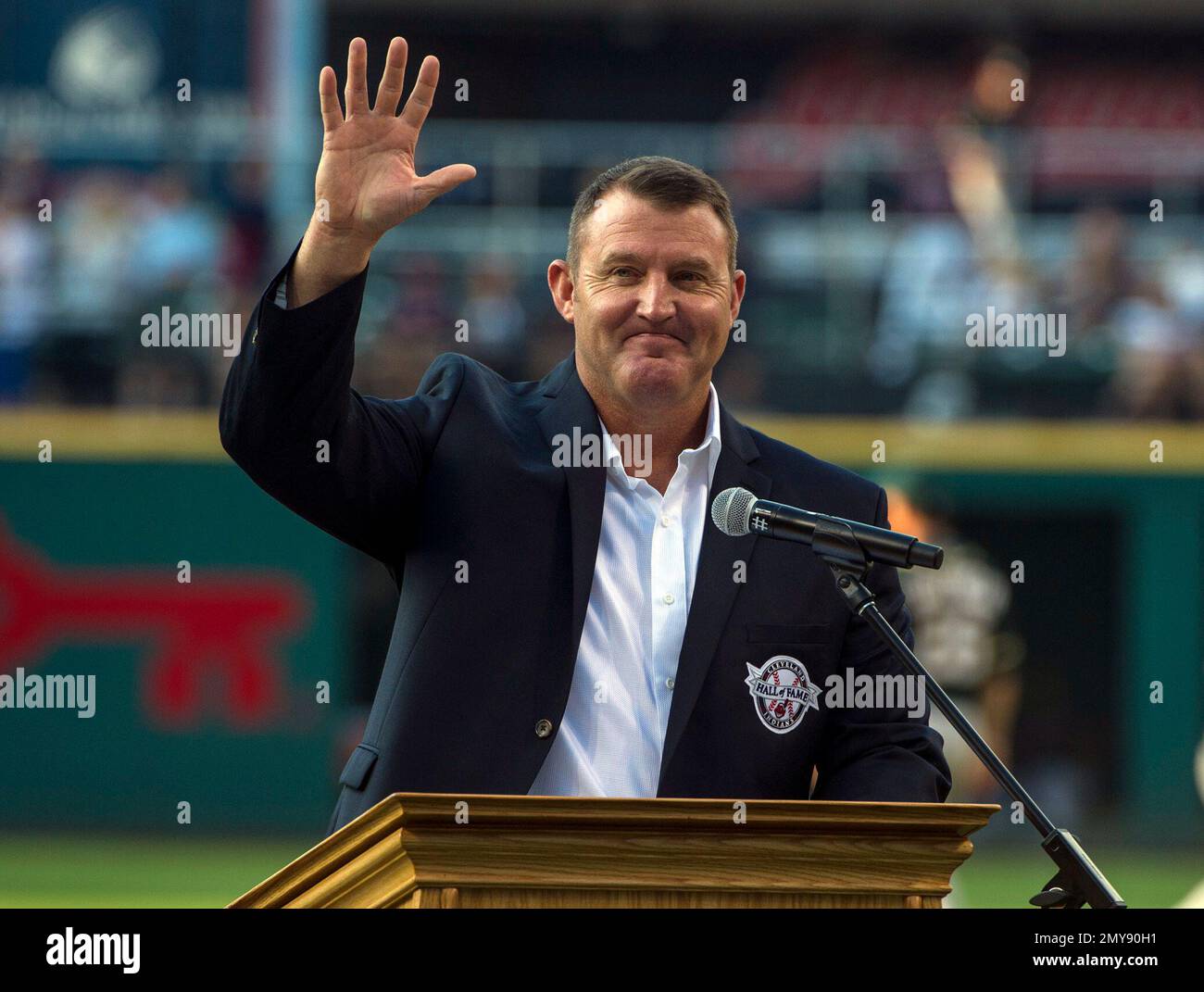 Former Oakland Athletics star and Hall of Famer Reggie Jackson, left,  stands with Josh Reddick in right field and acknowledges the crowd as the  1973 World Series championship team is honored in