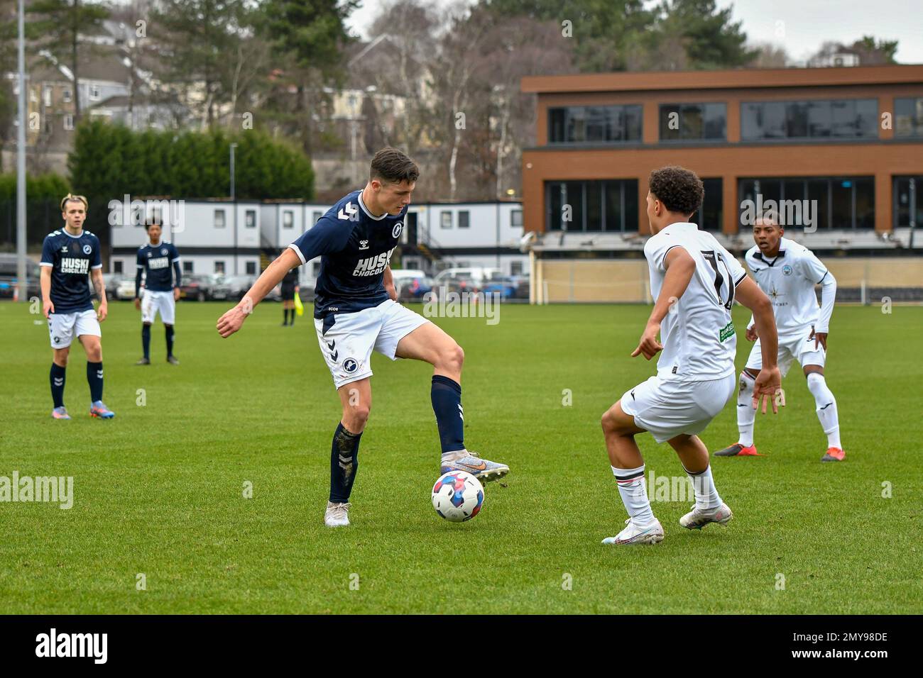 Swansea, Wales. 4 February 2023. Zane Myers of Swansea City under pressure  from Oliver Evans of Millwall during the Professional Development League  game between Swansea City Under 18 and Millwall Under 18