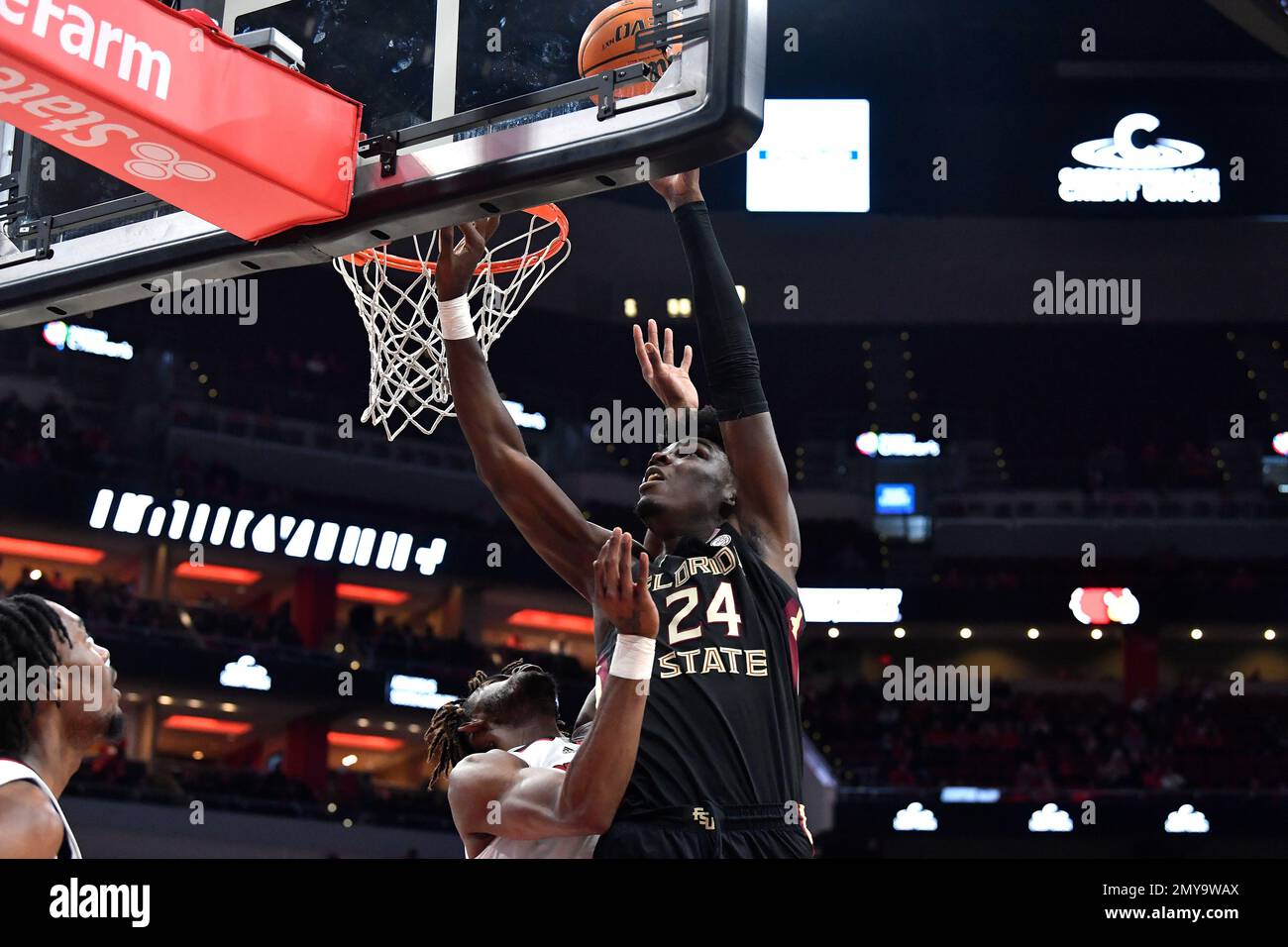 Florida State center Naheem McLeod (24) goes up for a layup oner Louisville forward Roosevelt