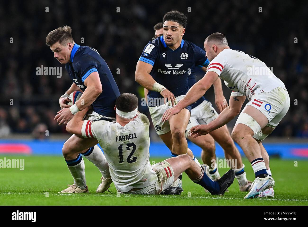 Huw Jones of Scotland is tackled by Owen Farrell of England during the 2023 Guinness 6 Nations match England vs Scotland at Twickenham Stadium, Twickenham, United Kingdom, 4th February 2023  (Photo by Craig Thomas/News Images) Stock Photo