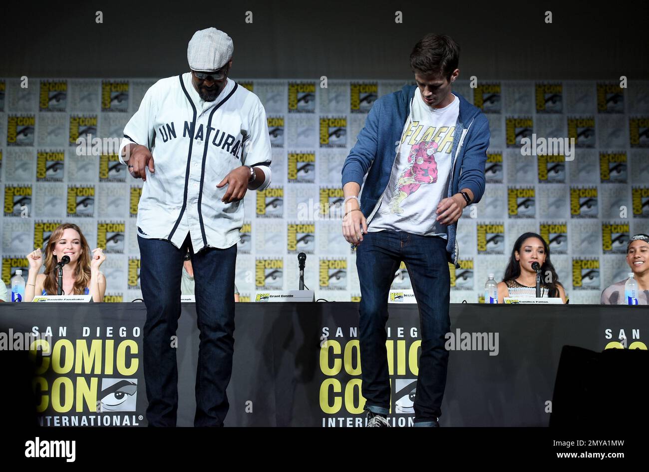 Jesse L. Martin, left, and Grant Gustin tap dance on stage at &ldquo;The 