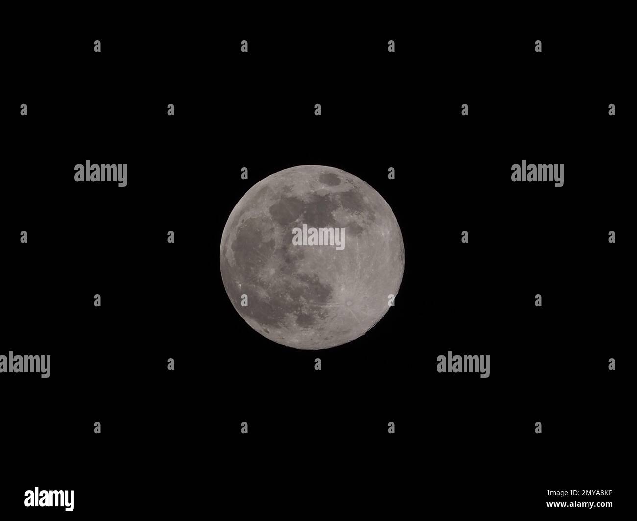 A bright full moon against a black background Stock Photo - Alamy