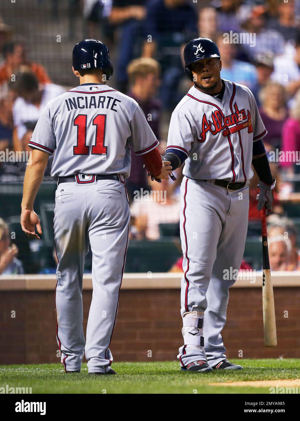 Atlanta Braves' Gordon Beckham, center is congratulated by Adonis