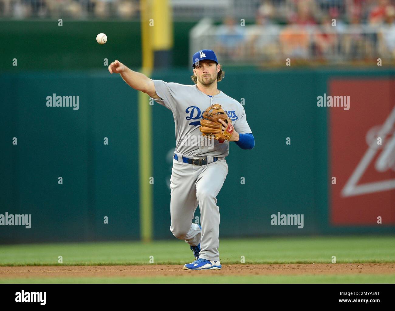 Los Angeles Dodgers shortstop Charlie Culberson throws to first to