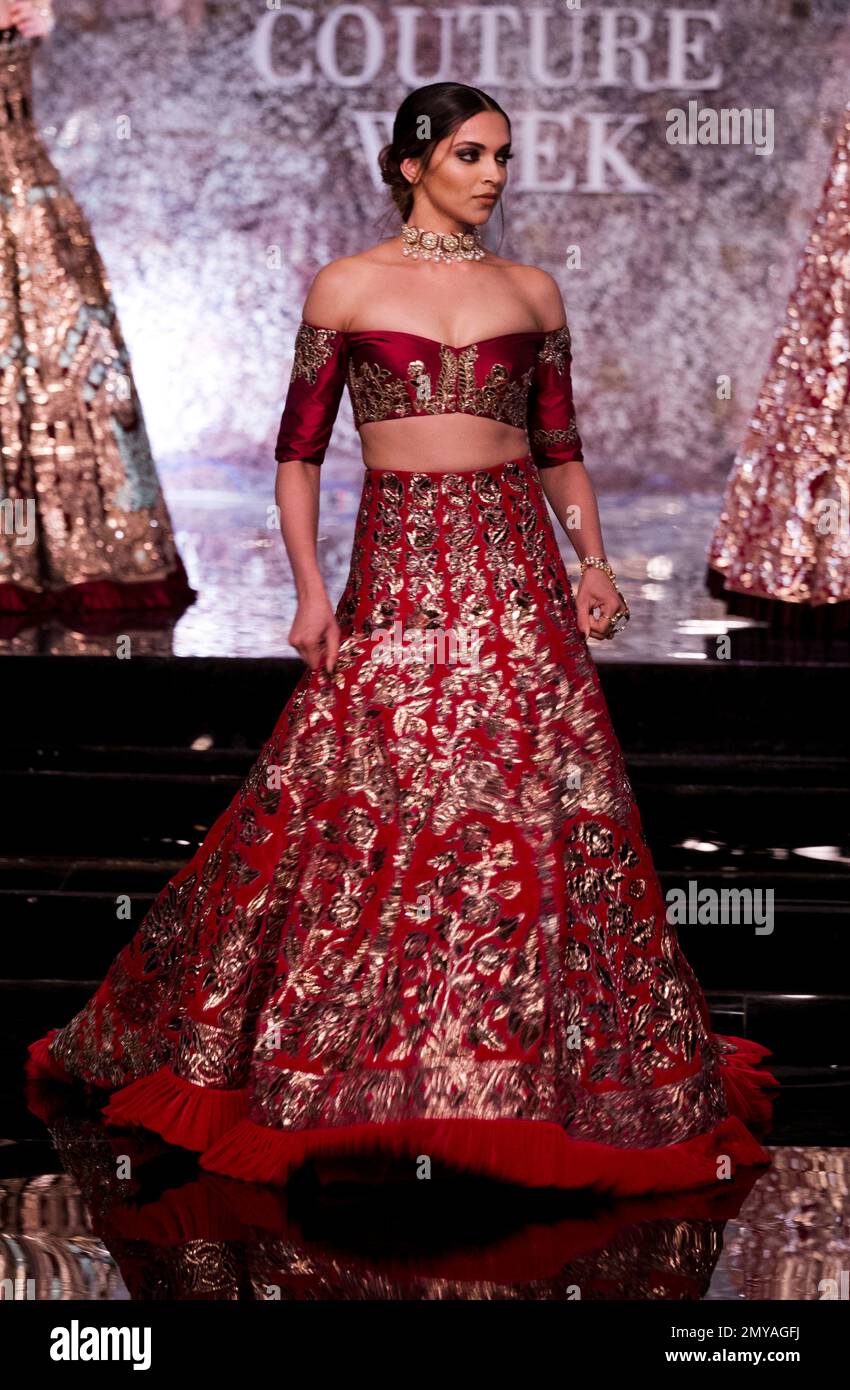Bollywood actress Deepika Padukone displays a creation by India designer Manish Malhotra at the India Couture Week 2016 in New Delhi India Wednesday July 20 2016. AP Photo Tsering Topgyal Stock Photo ...