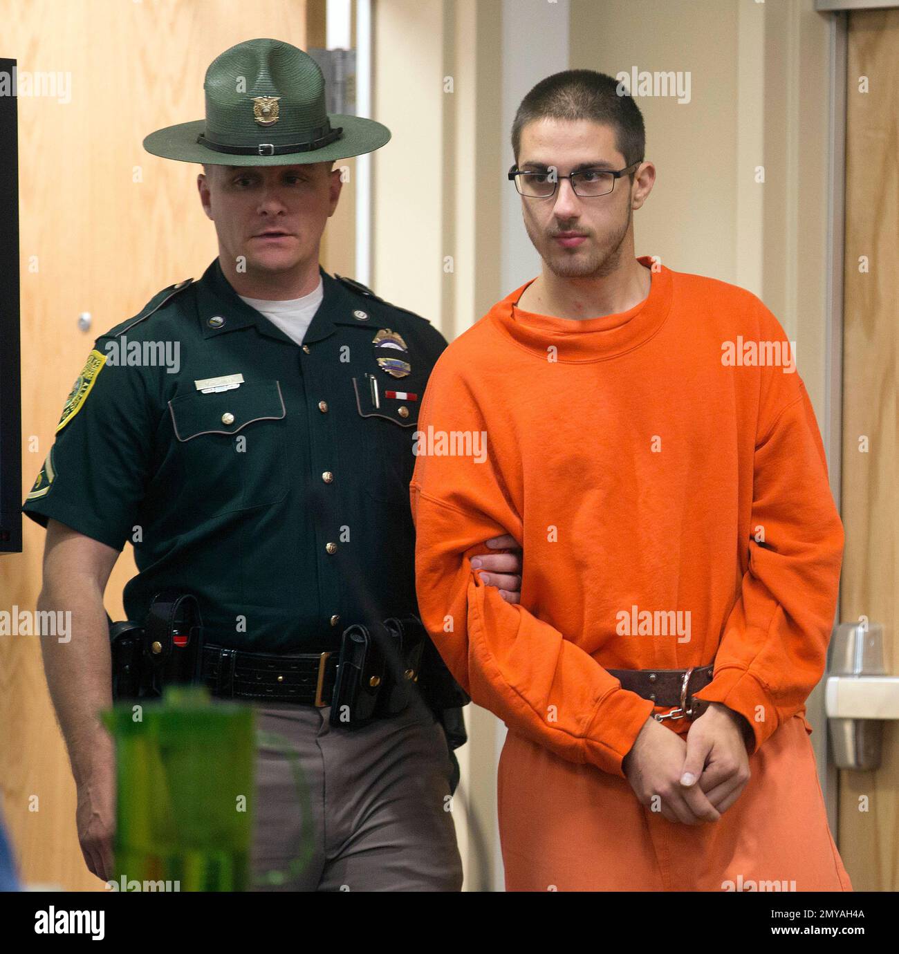 Peter Giandalone is escorted into Cheshire County Superior Court in Peter Giandalone is escorted into Cheshire County Superior Court in