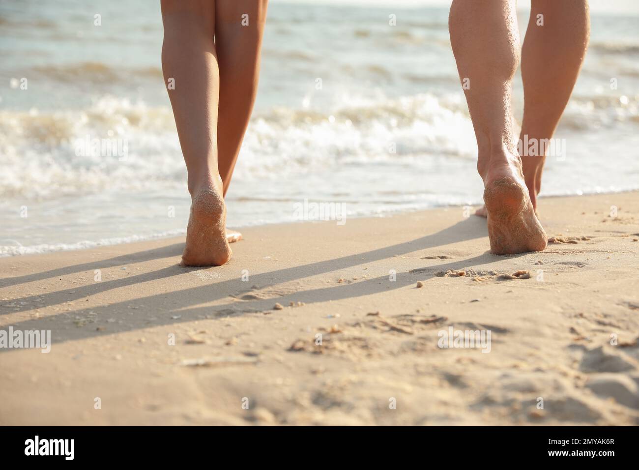 Male feet walking on sand hi-res stock photography and images - Alamy
