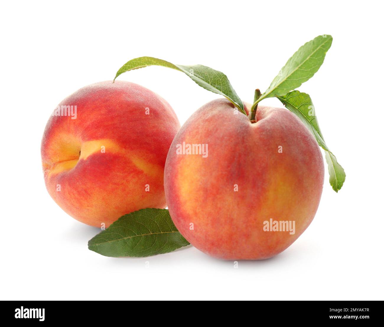 Delicious ripe juicy peaches with leaves isolated on white Stock Photo ...
