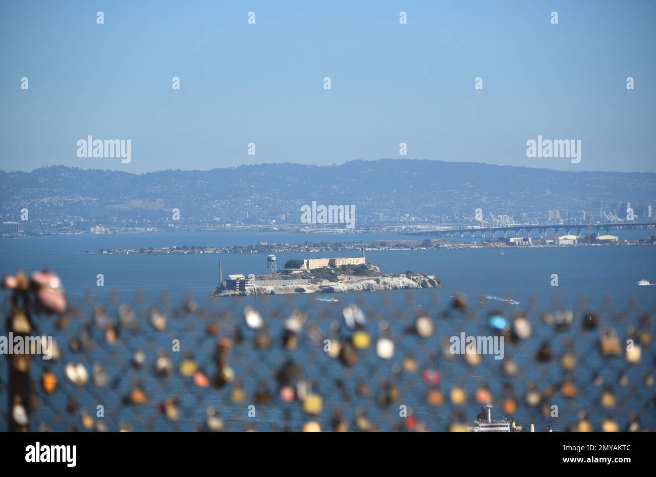 Panoramic overview, in large format, of the San Francisco bay featuring Alcatraz island, Treasure island and Bay bridge, with love locks. Stock Photo