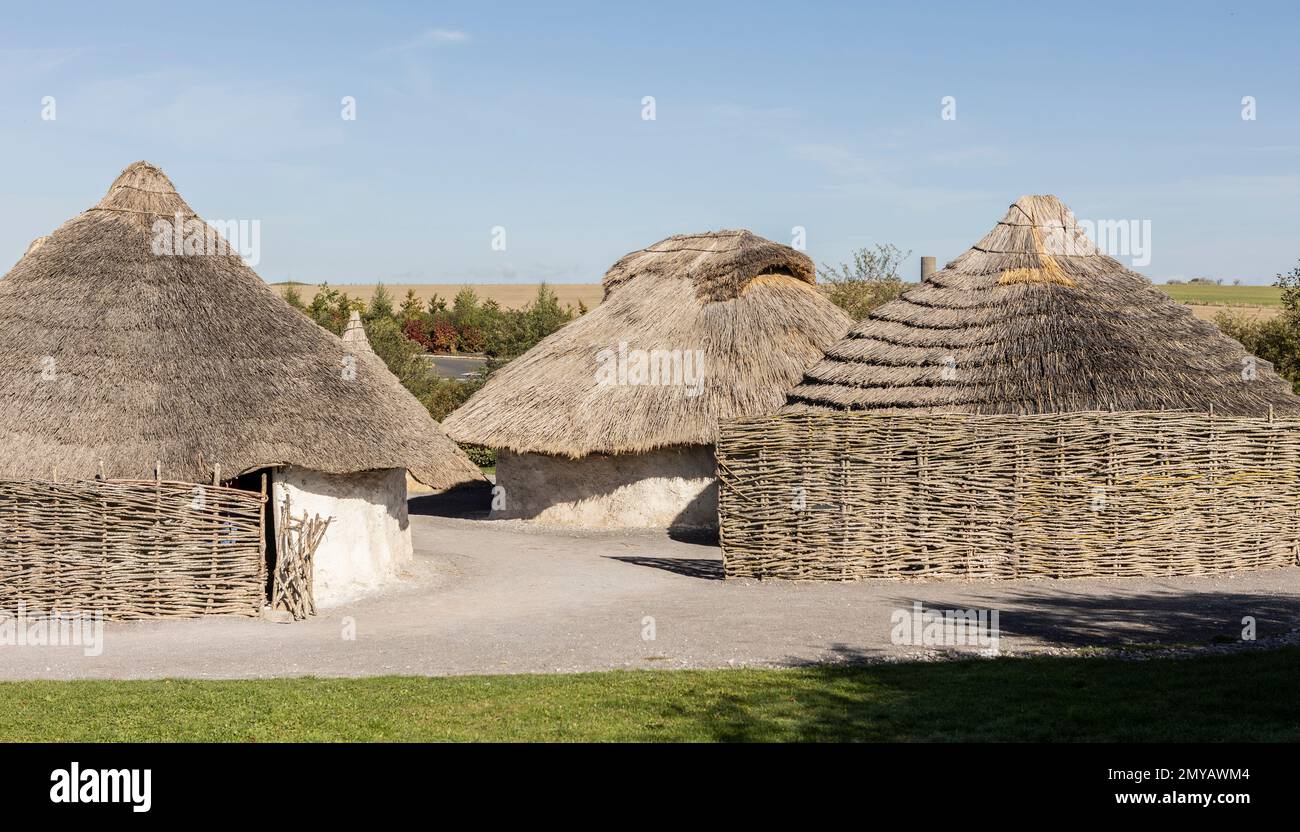 Neat white houses of wattle and daub with thatched roofs Stock Photo