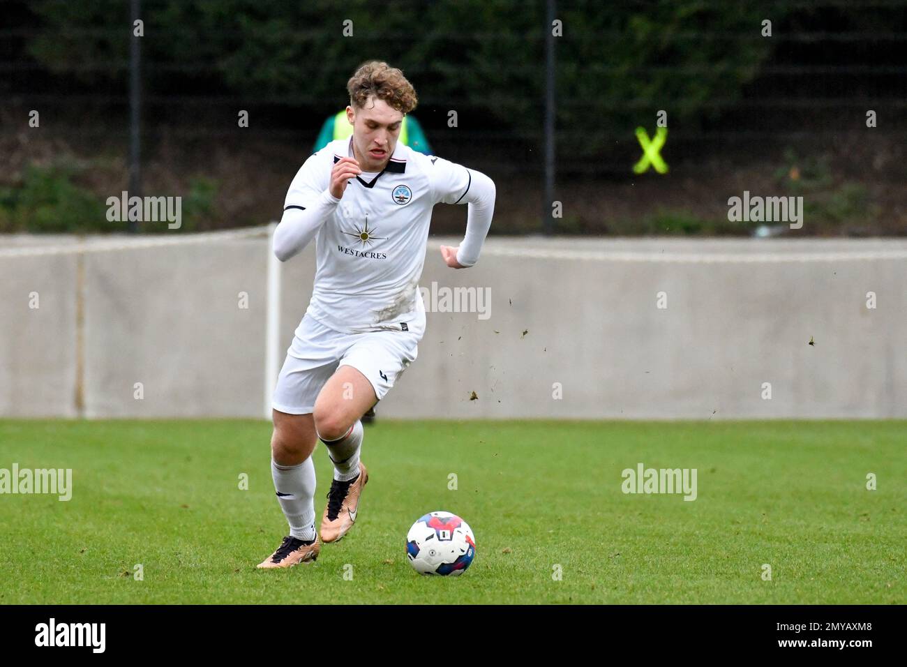 Swansea, Wales. 4 February 2023. Iwan Morgan of Swansea City high fives  Aimar Govea of Swansea City during the Professional Development League game  between Swansea City Under 18 and Millwall Under 18