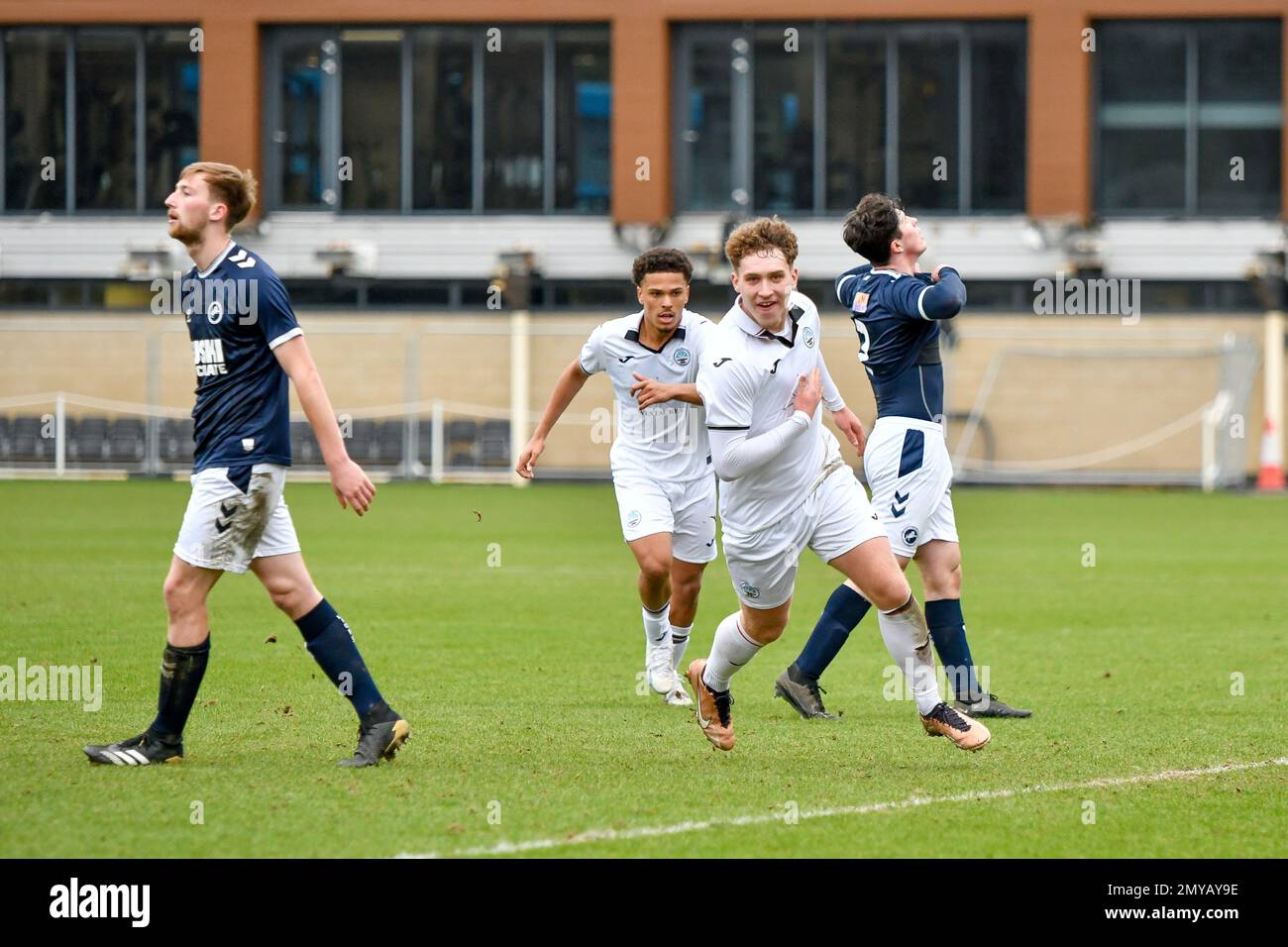 Swansea, Wales. 4 February 2023. Iwan Morgan of Swansea City high fives  Aimar Govea of Swansea City during the Professional Development League game  between Swansea City Under 18 and Millwall Under 18