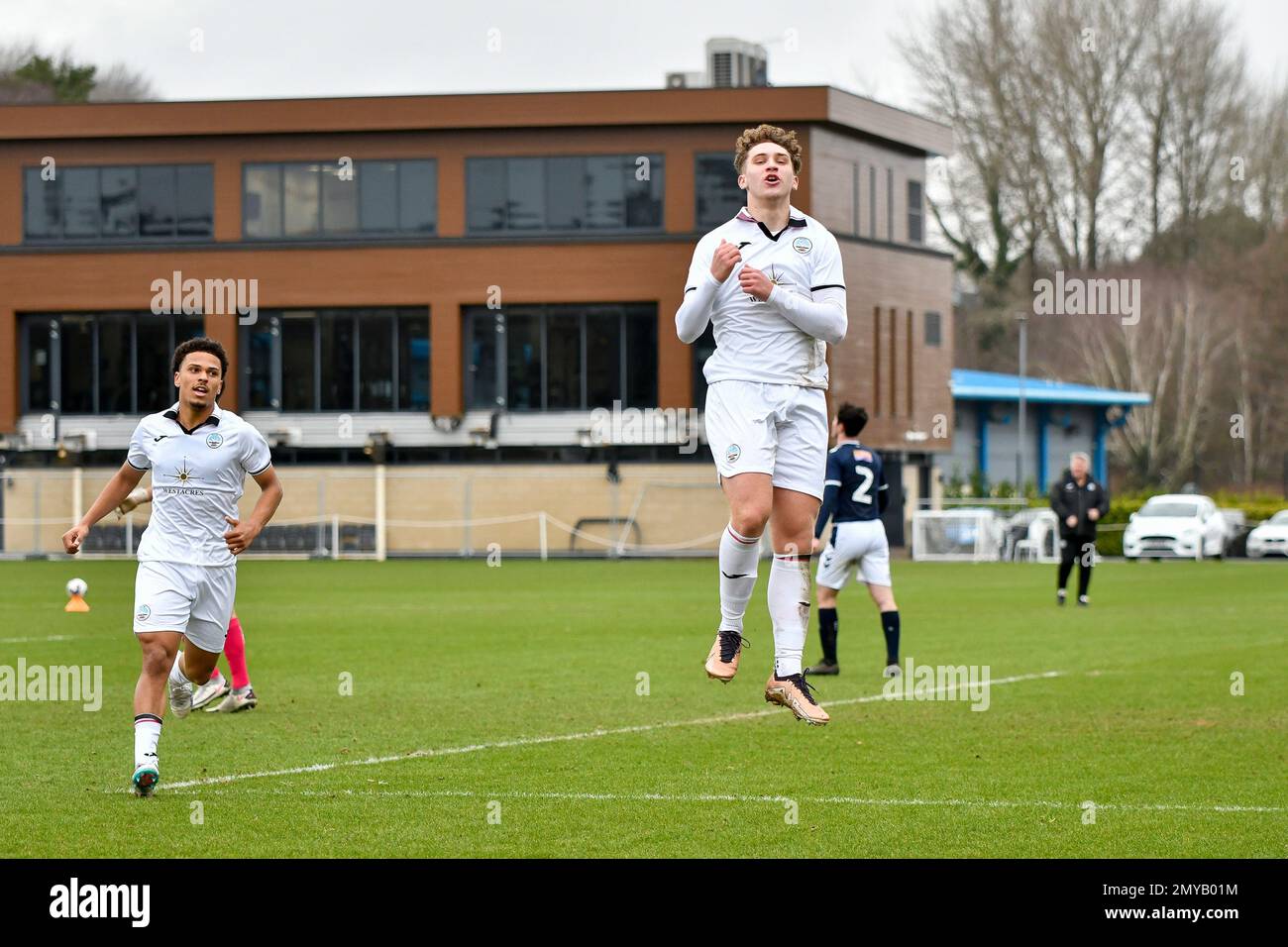 Swansea, Wales. 4 February 2023. Zane Myers of Swansea City under pressure  from Oliver Evans of Millwall during the Professional Development League  game between Swansea City Under 18 and Millwall Under 18