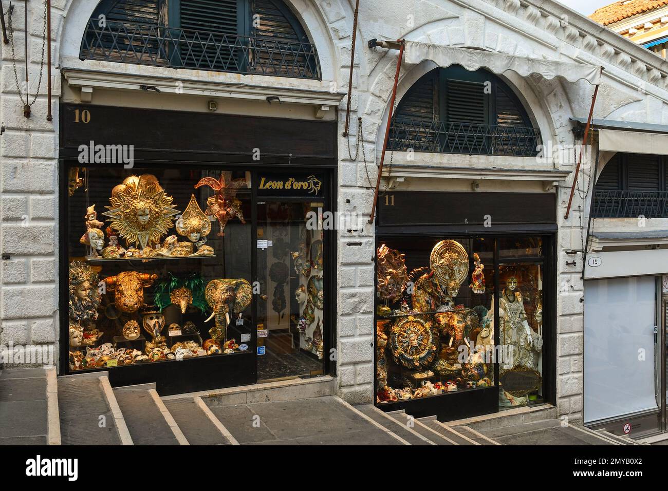 Exterior and shop windows of a Venetian mask shop on the Rialto Bridge empty at dawn, Venice, Veneto, Italy Stock Photo