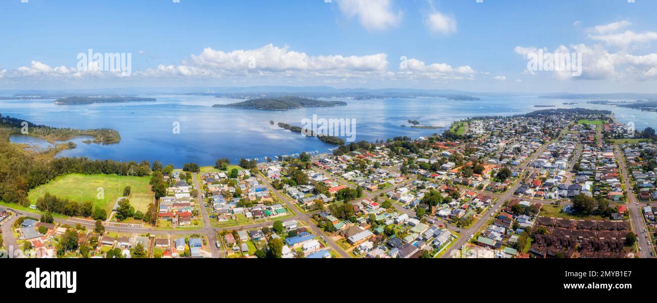 Elevated aerial panorama of lakeshore at Swansea coastal town on Lake Macquarie waterfront of Australia. Stock Photo