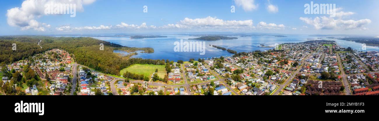 Wide aerial panorama of lakeshore at Swansea coastal town on Lake Macquarie waterfront of Australia. Stock Photo