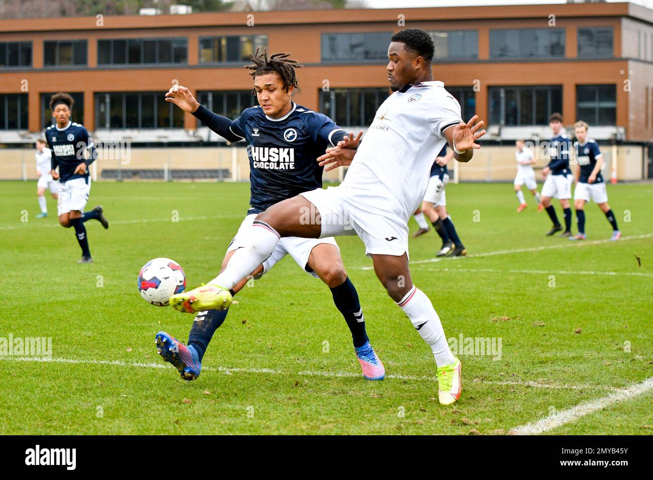 Swansea, Wales. 4 February 2023. Geoffroy Bony of Swansea City battles for  possession with Kyron Horsley-McKay of Millwall during the Professional  Development League game between Swansea City Under 18 and Millwall Under