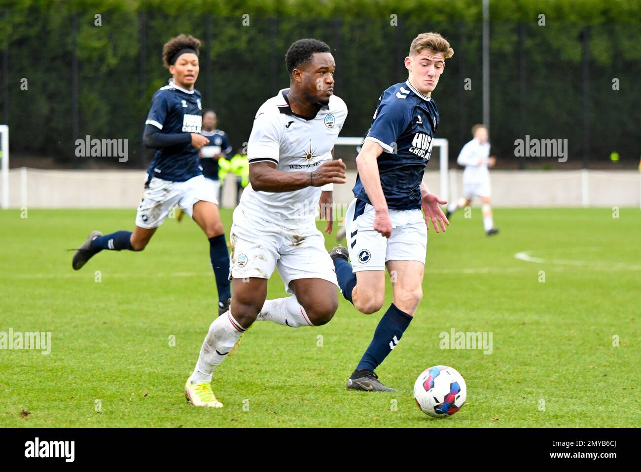 Swansea, Wales. 4 February 2023. Geoffroy Bony of Swansea City battles for  possession with Kyron Horsley-McKay of Millwall during the Professional  Development League game between Swansea City Under 18 and Millwall Under